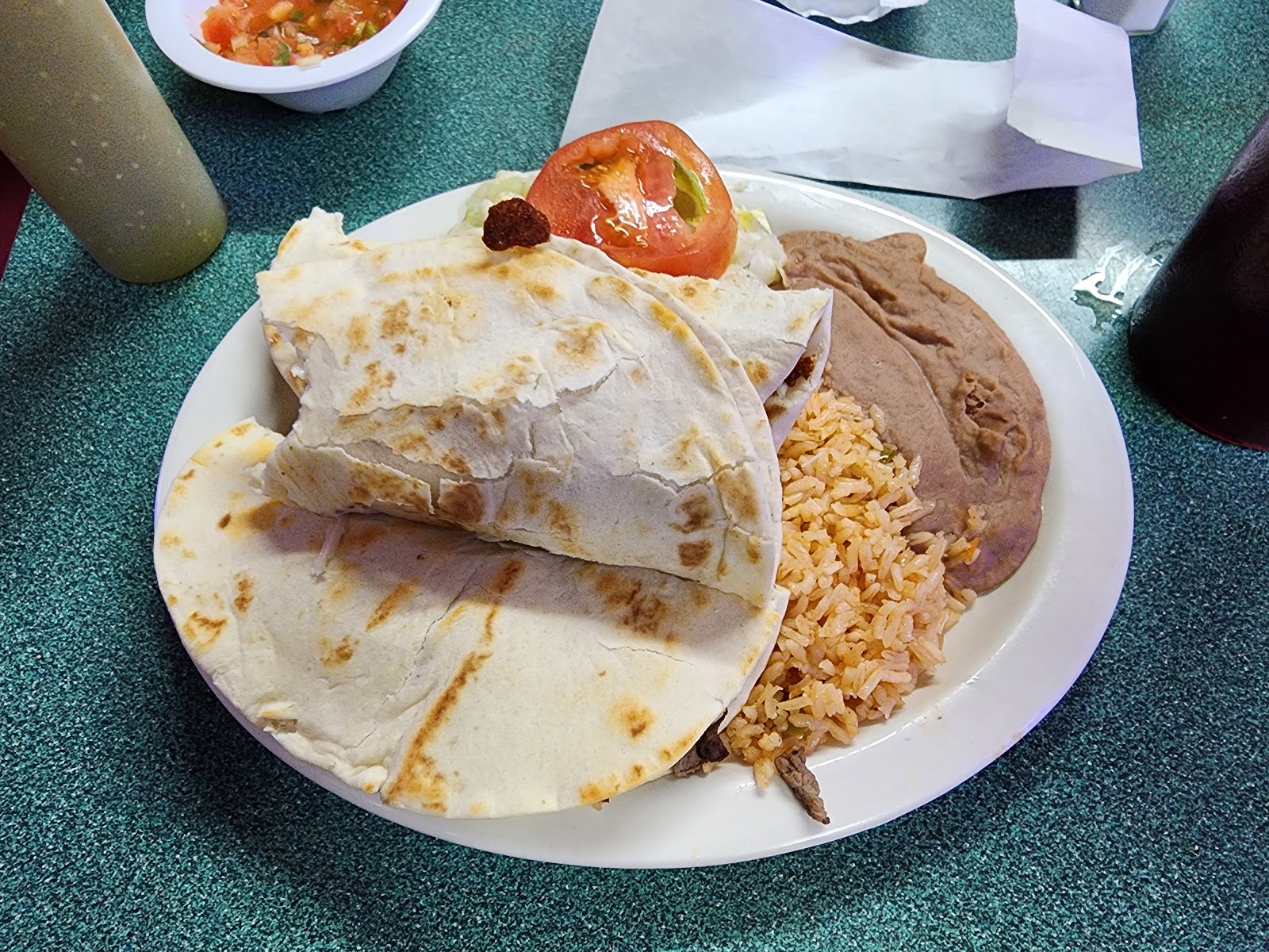 Quesadilla plate with rice, beans and tomato